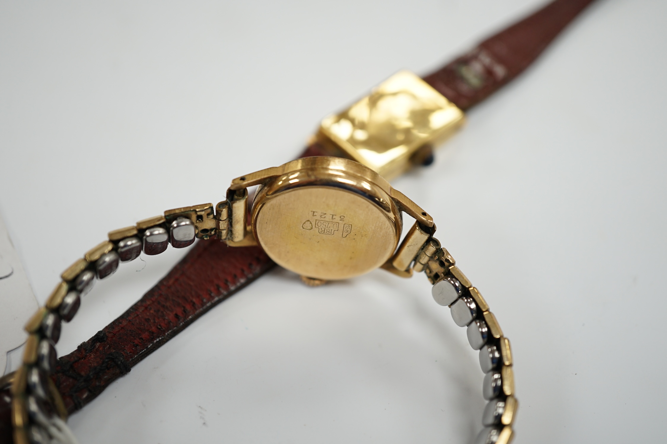 Two 18k cased lady's manual wind wrist watches, including Kismet, on gold plated or leather bracelets.